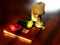 Book-rose-and-candle-on-teak