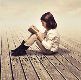 Child sat reading a book