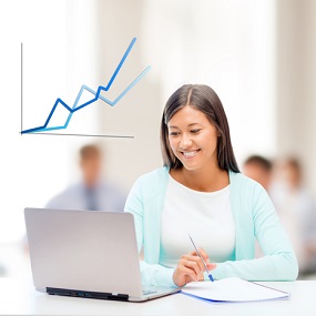 A level Economics Student studying at a computer