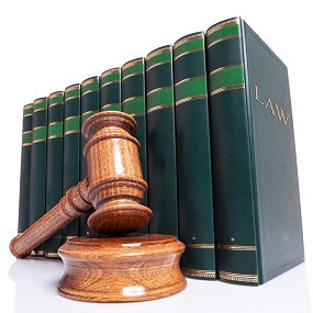 Law books with a gavel and sounding block