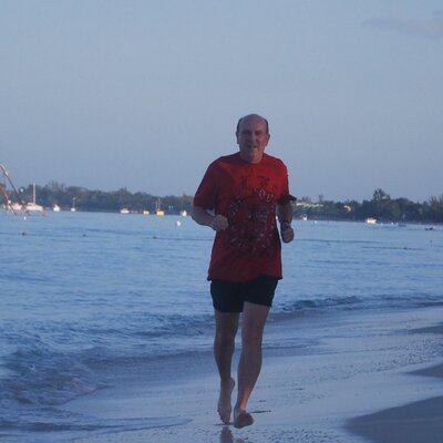 Student jogging on beach