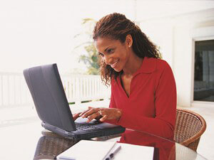 Mature distance learning student studying from laptop