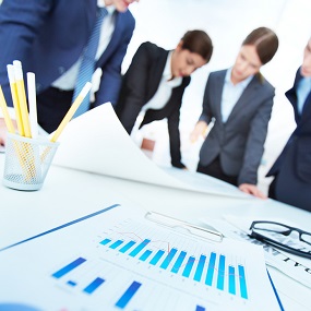 A group of business people looking over paperwork